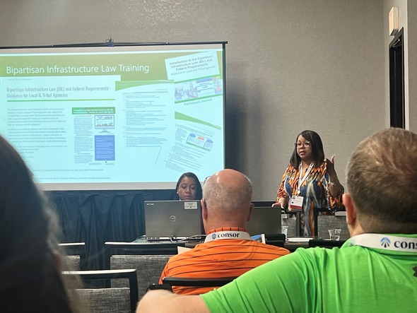 Danielle Mathis-Lee standing and Trinette Ballard present during the 2024 National Association of County Engineers.